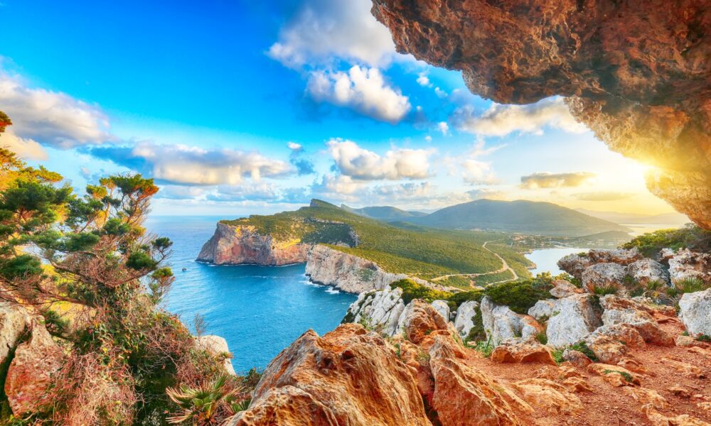 Fantastic morning view on Cacccia cape. View from the cave on the cliff. Fantastic  Mediterranean seascape. Location:  Alghero, Province of Sassari, Italy, Europe